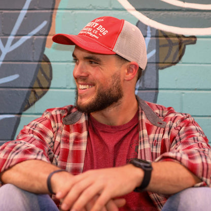 Unisex vintage red trucker hat worn outdoors by Scruffy Dog